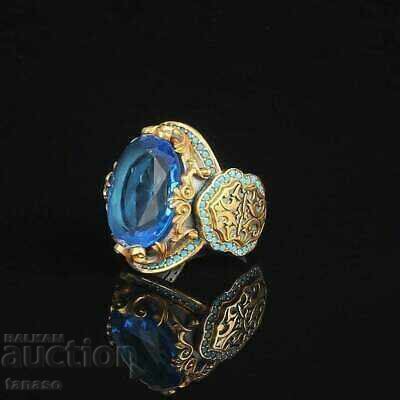Women's ring with blue topaz and rhodium plating