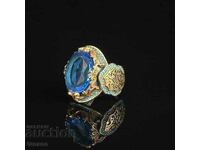 Γυναικείο δαχτυλίδι με μπλε τοπάζι και ρόδιο