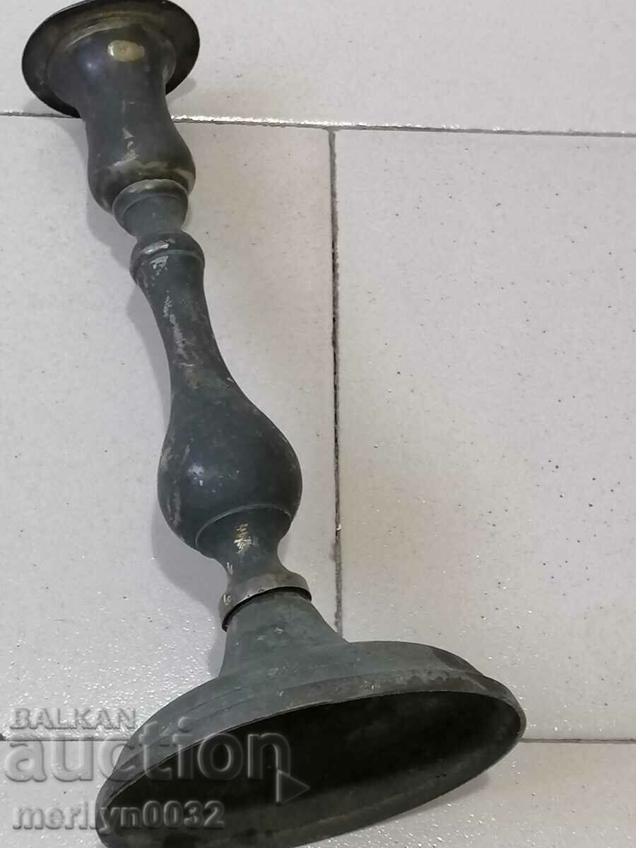 Auction  An old brass candlestick