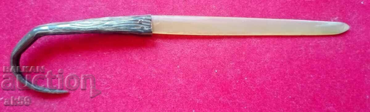 An old letter knife made of polished horn.