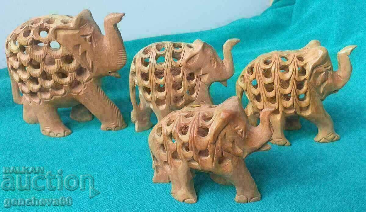 Auction Figures of 4 elephants/wood carving Auction Figures of 4 elephants/wood carving