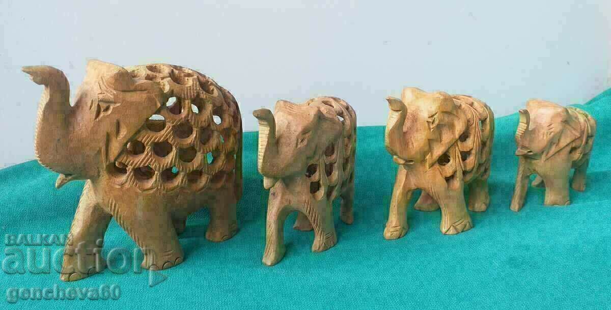 Figures of 4 elephants/wood carving Figures of 4 elephants/wood carving