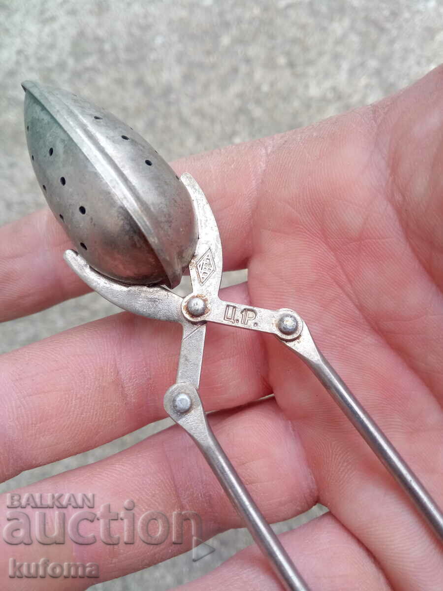 Auction  An old tea tong