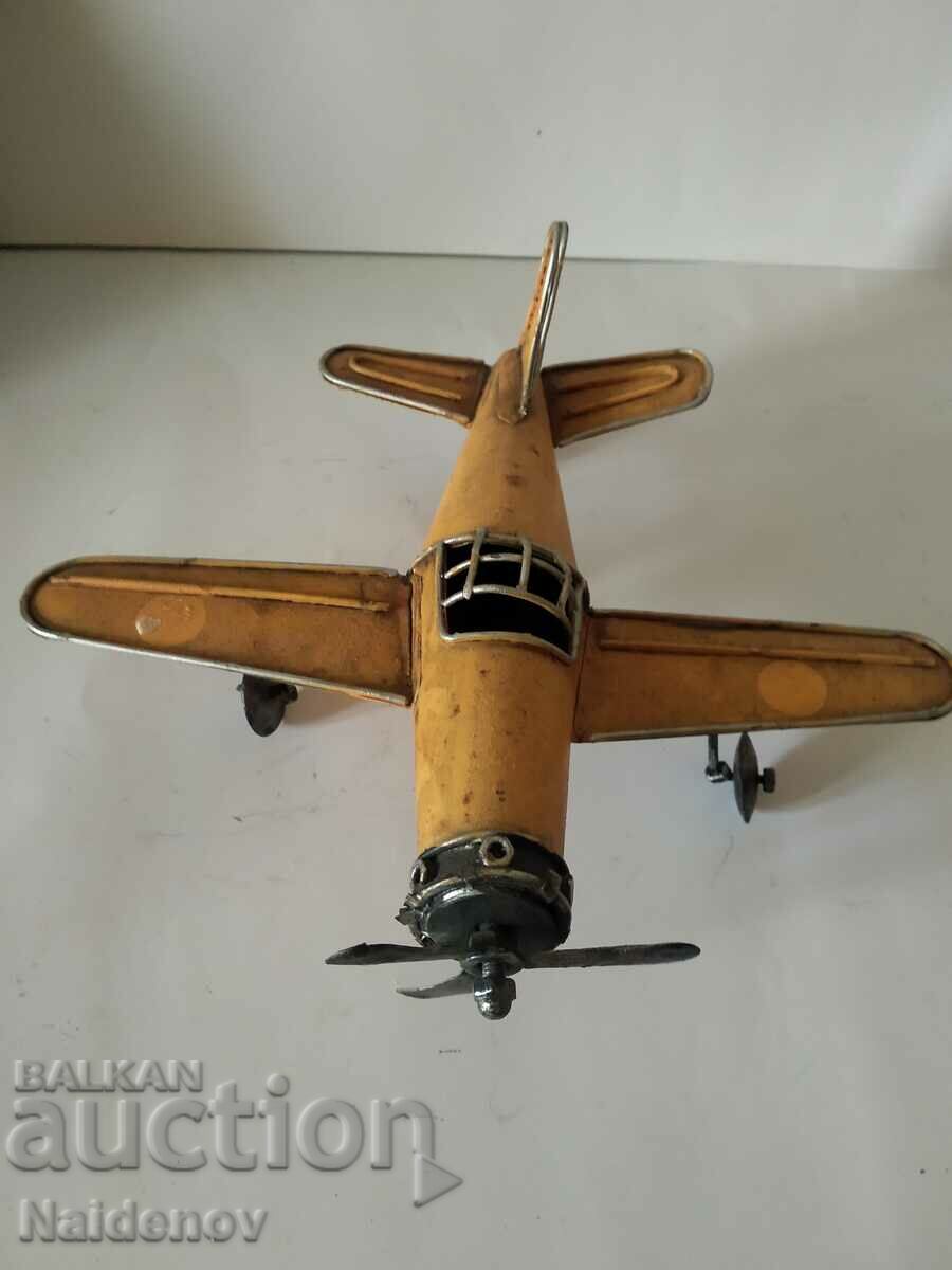 Old tin toy airplane