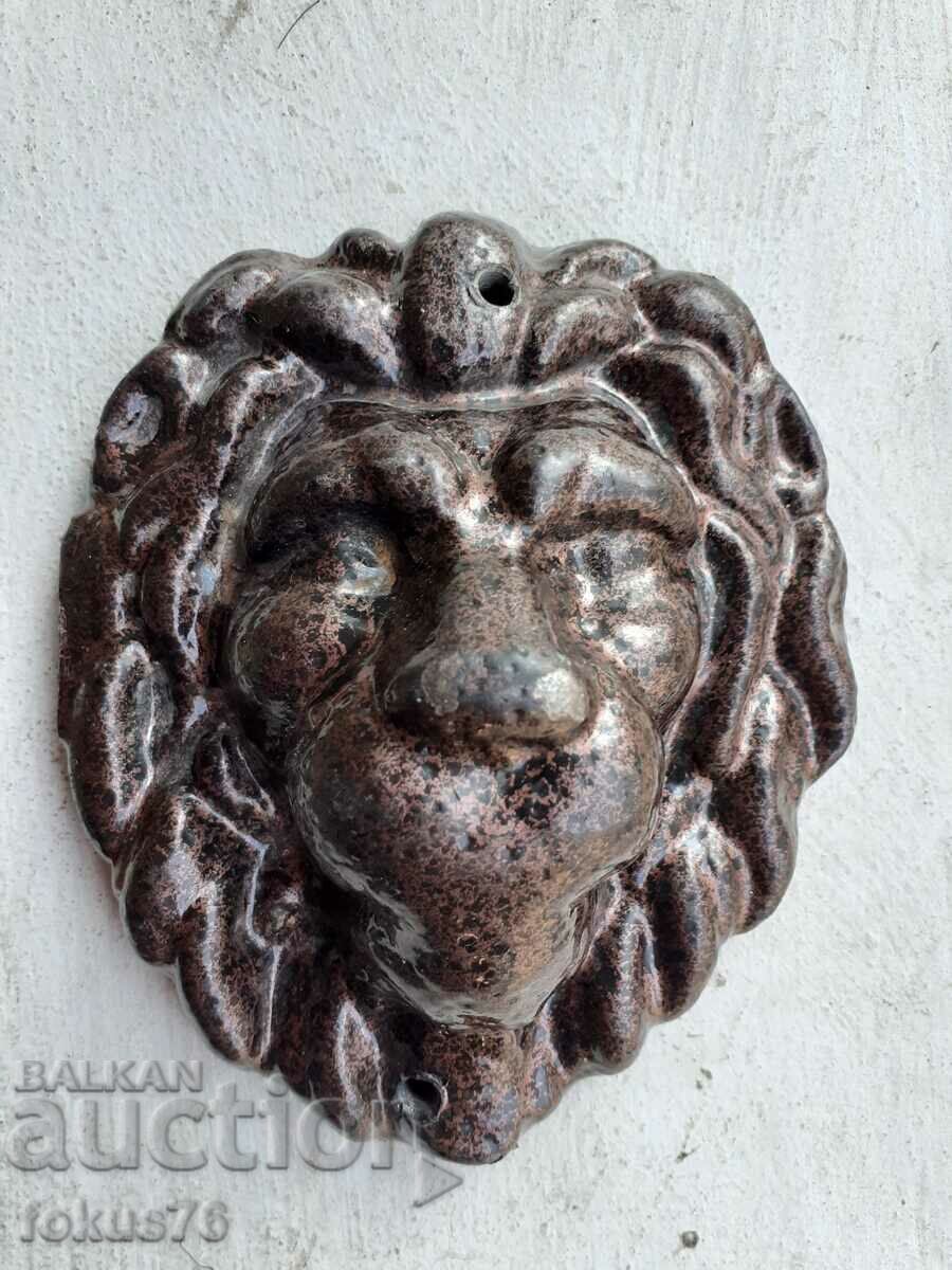Cast iron lion head applique