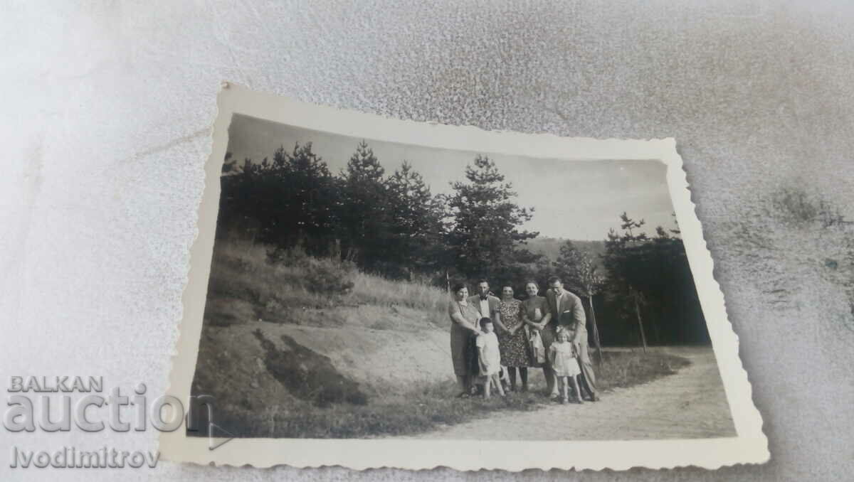 Photo Two men, women and two children on a road in the mountains, 1940