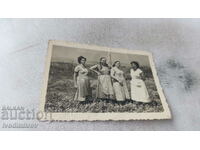 Photo Four women in the field