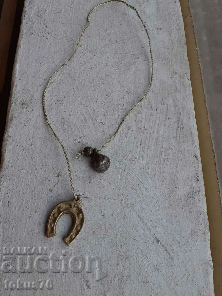 Auction Miniature bronze horseshoe with weight Auction Miniature bronze horseshoe with weight