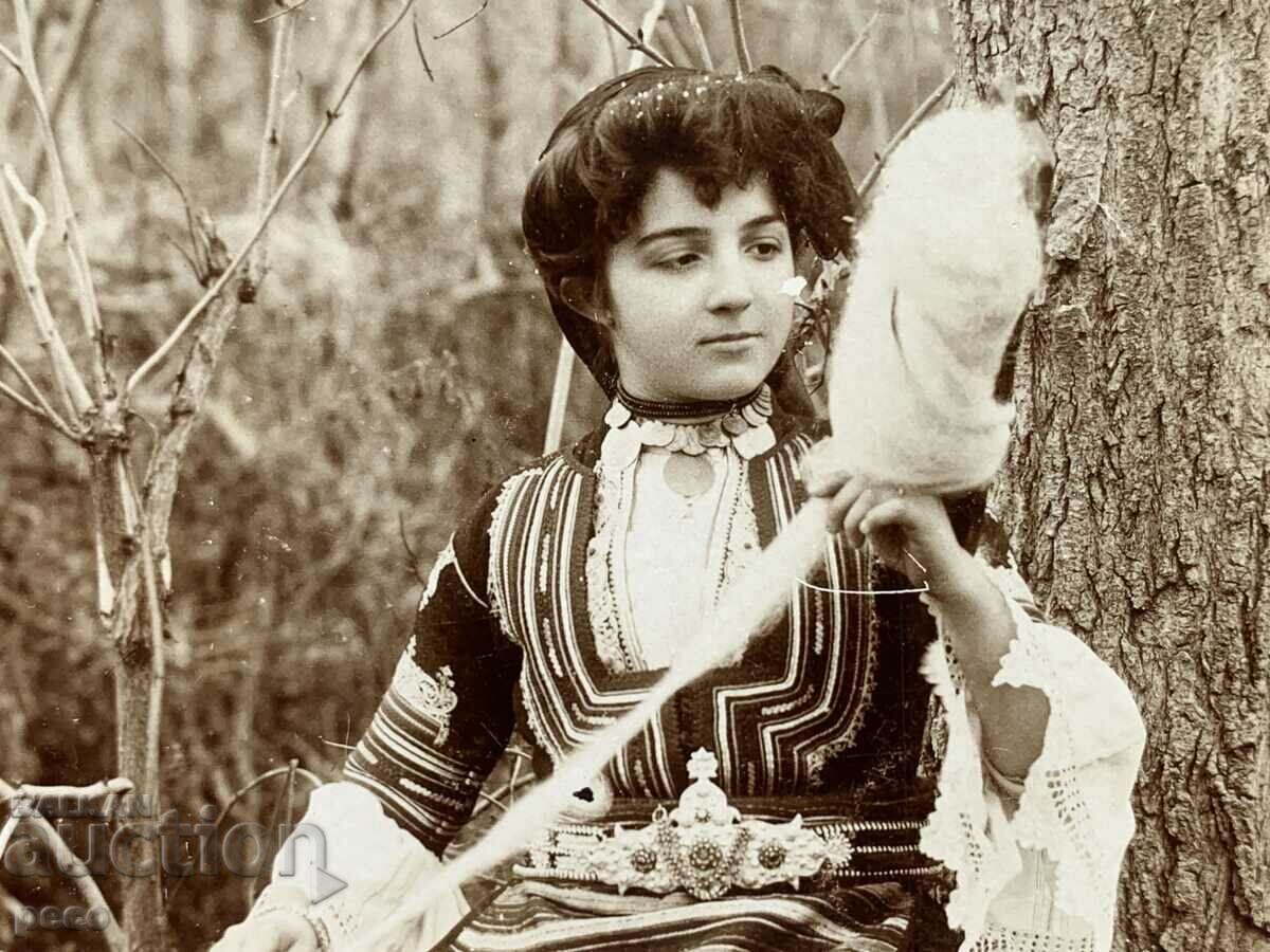A beautiful Bulgarian woman in a Kyustendil costume before wearing a hurka, 1906. with price 40.00 BGN | € 20.45