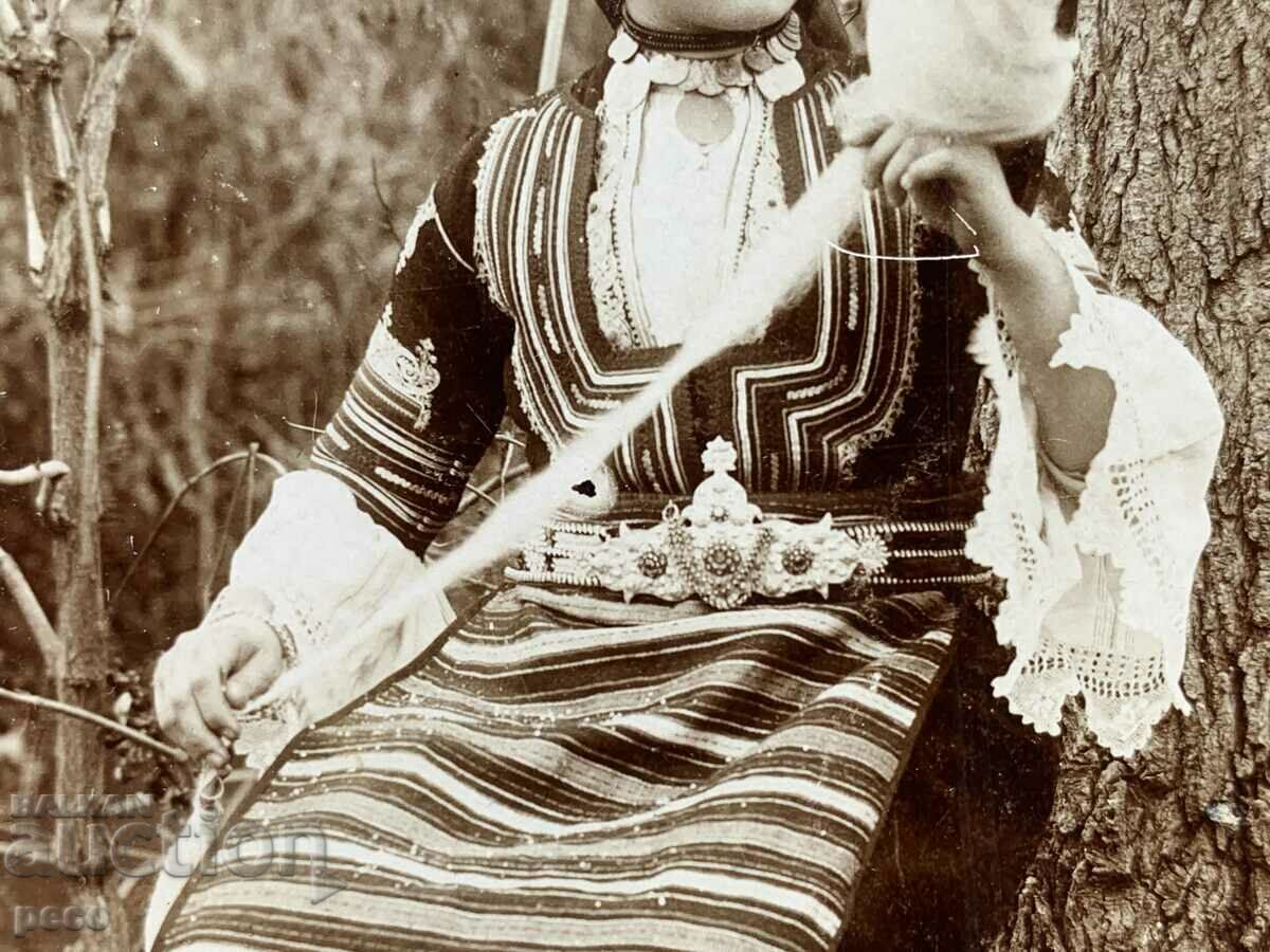 Auction  A beautiful Bulgarian woman in a Kyustendil costume before wearing a hurka, 1906.
