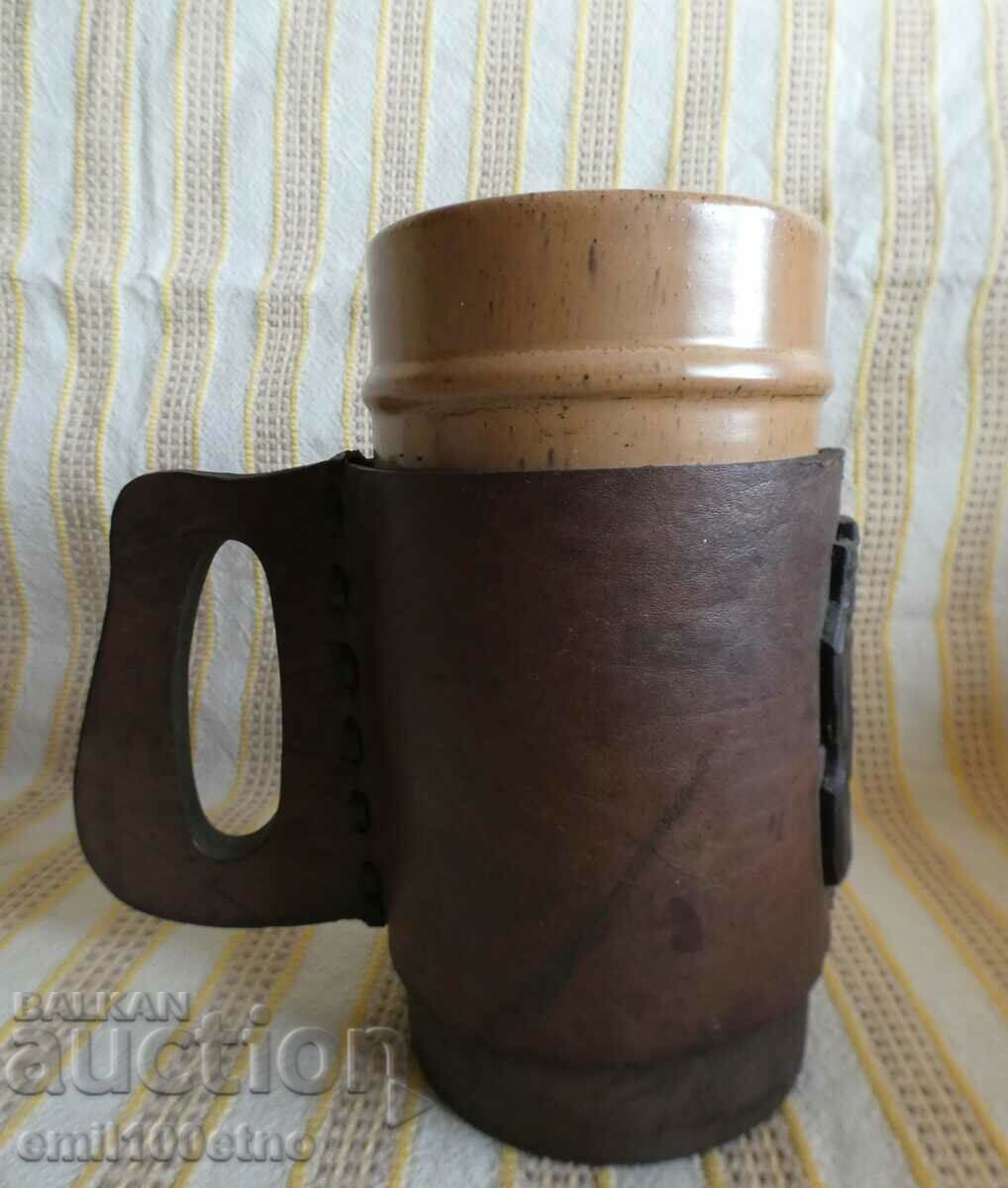 Ceramic mug with leather cover and metal coat of arms of Sofia with price 20.00 BGN | € 10.23 Ceramic mug with leather cover and metal coat of arms of Sofia with price 20.00 BGN | € 10.23