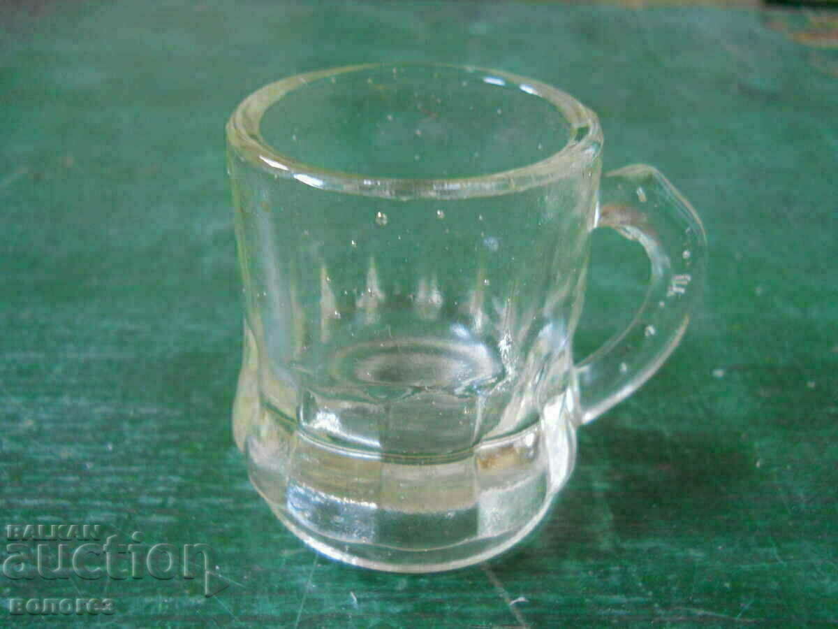 a small glass cup