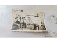Photo A man and three young girls on the steamship ISKARA