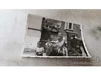 Photo Man and children on a donkey on a country street