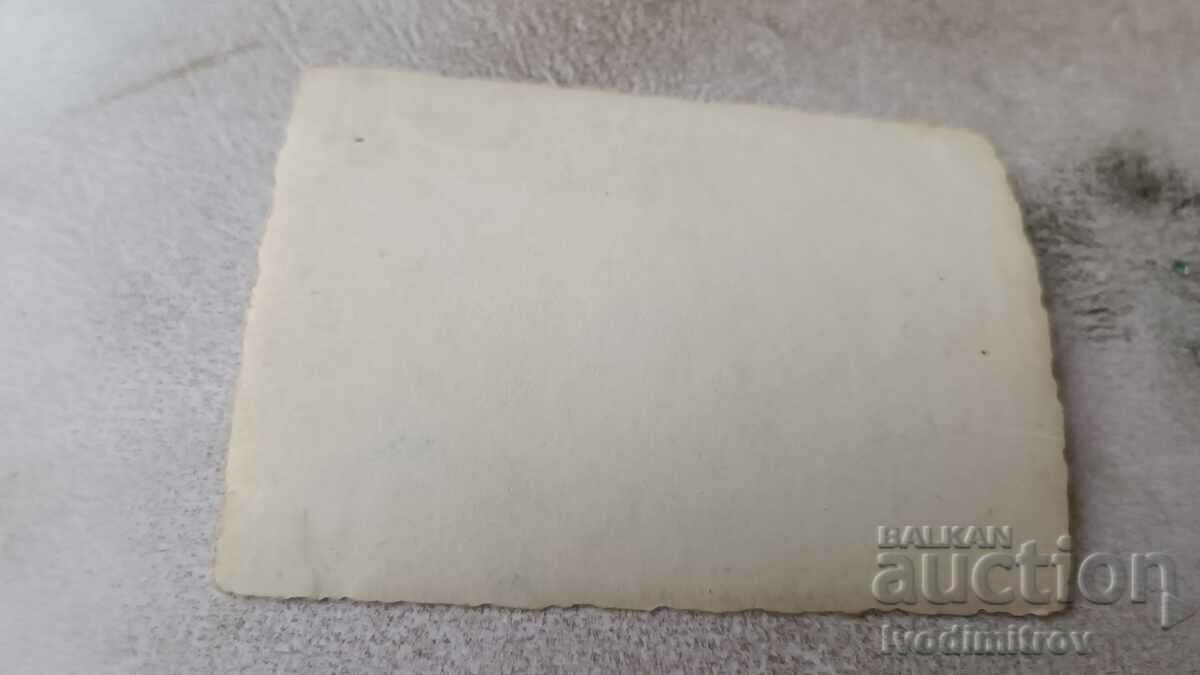 Photo Four soldiers smoking a cigarette in the park with price 0.85 BGN | € 0.43