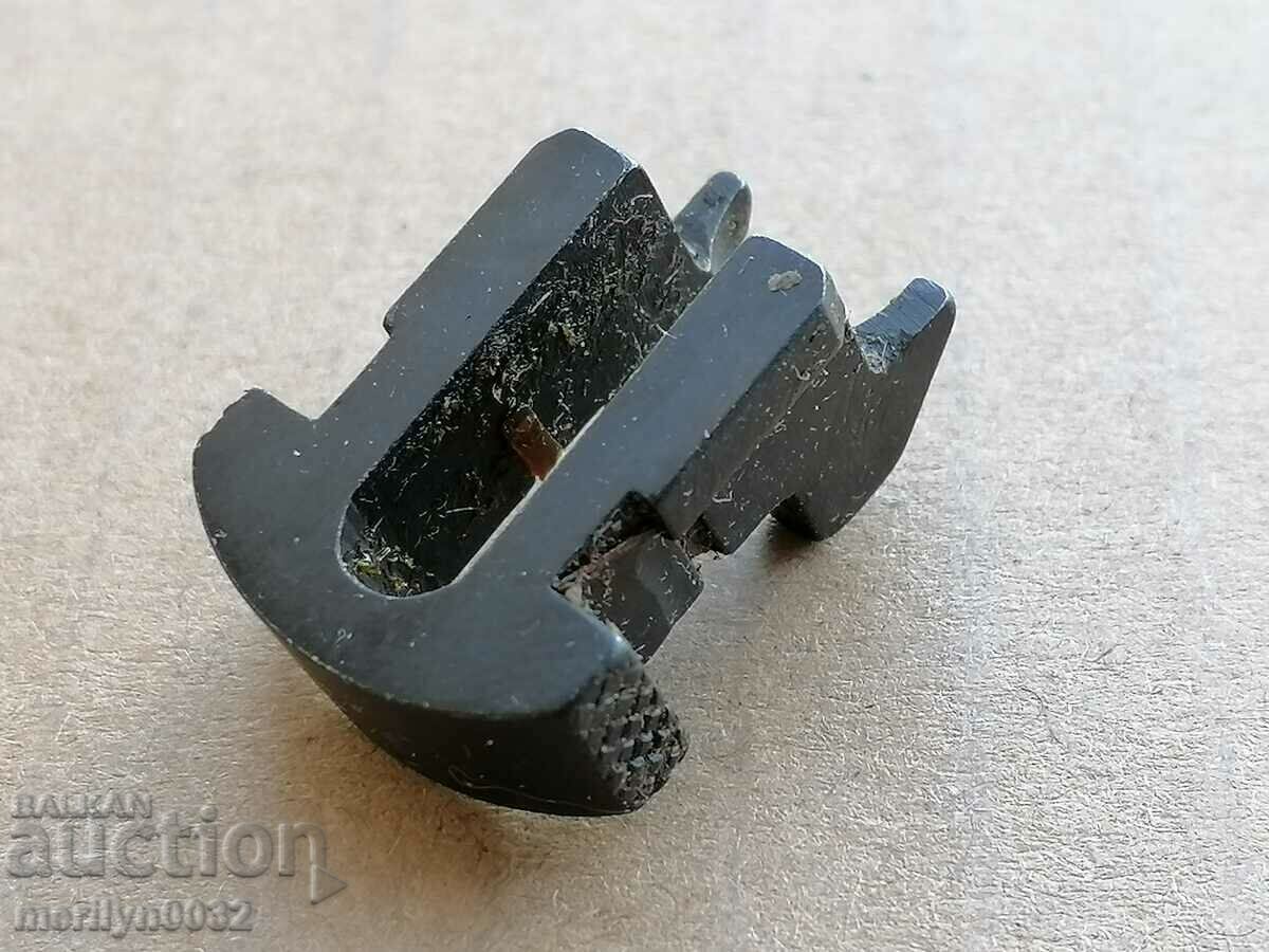 Delivery of Part, detail for a bayonet knife on an AK-47 button Delivery of Part, detail for a bayonet knife on an AK-47 button