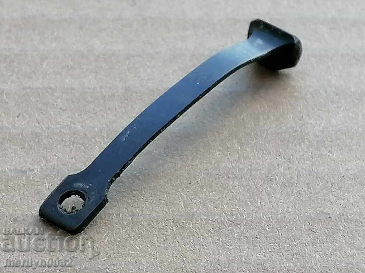 The plastic spring part of a carbine rifle scope