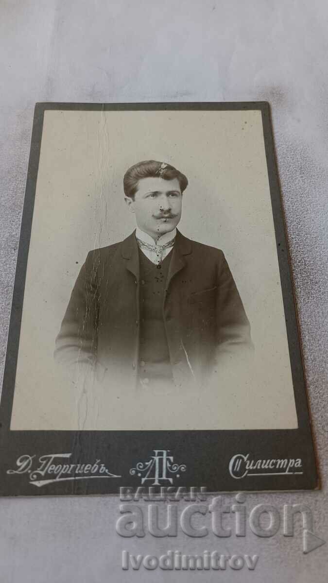 Poza Bărbat în costum negru și mustață Carton