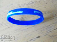 Silicone wristband. Advertisement of REFORM BLOCK.