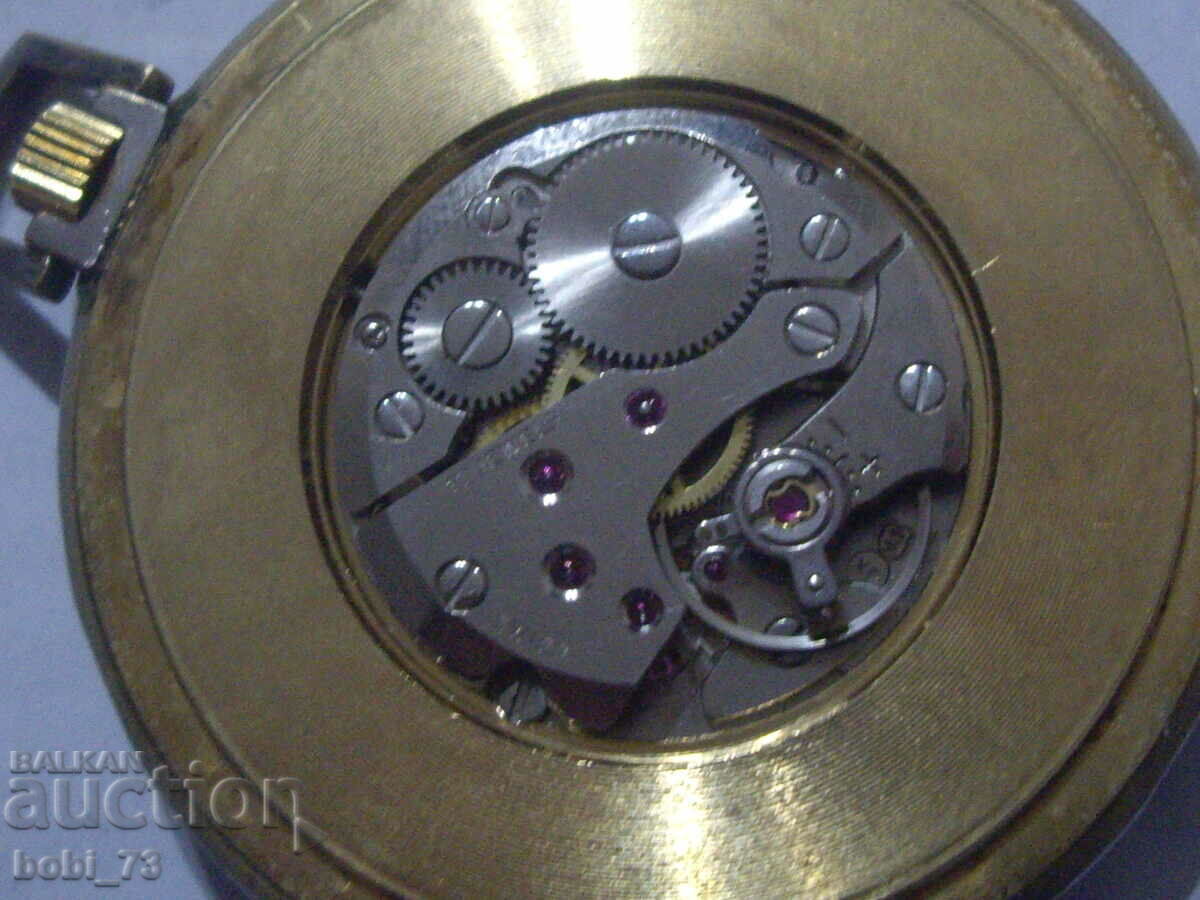 Delivery of Old pocket watch with colored enamel. Delivery of Old pocket watch with colored enamel.