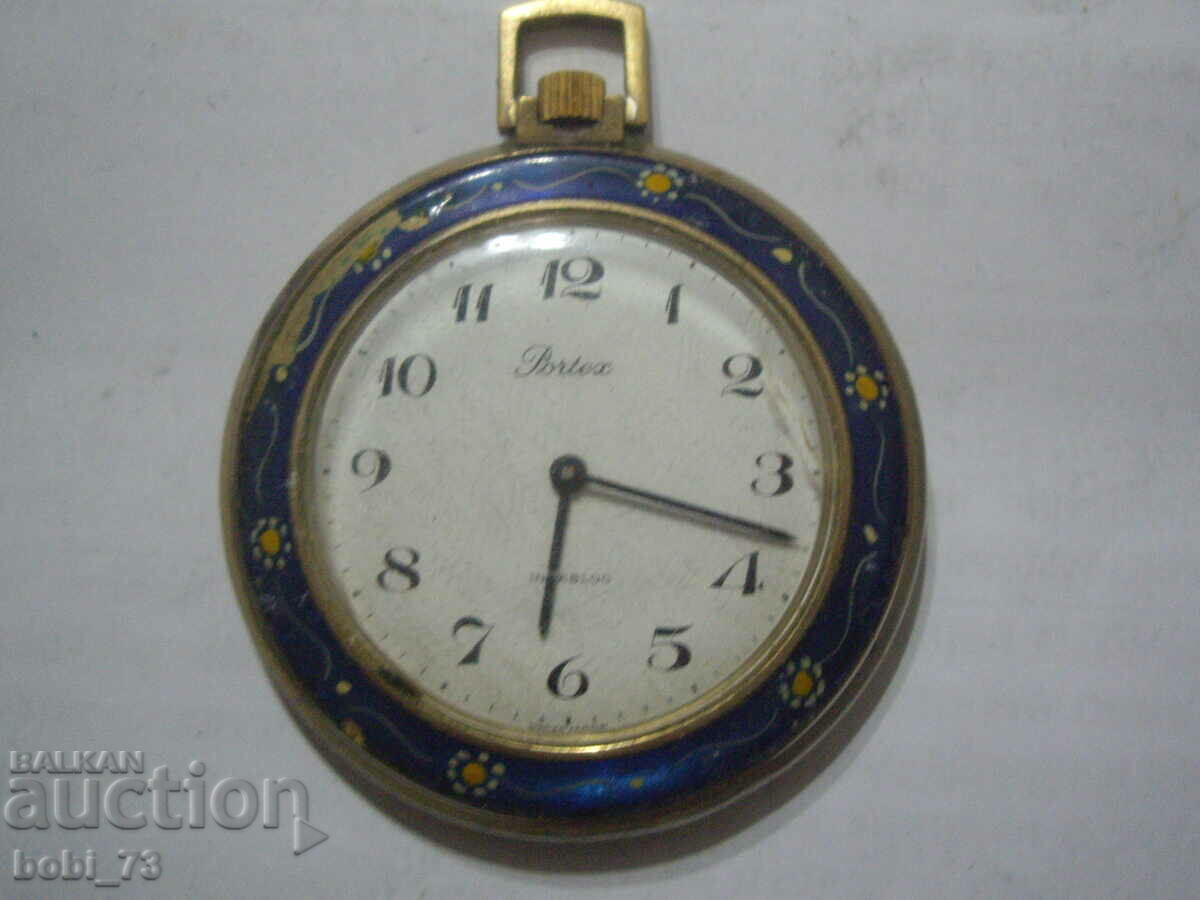 Old pocket watch with colored enamel.