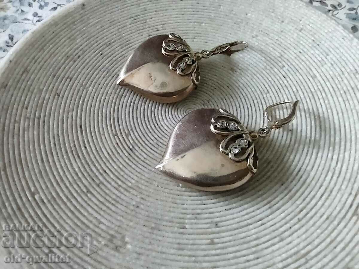 Delivery of Silver earrings with delicate gilding and stones