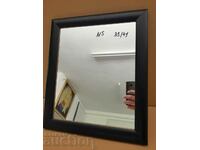 Mirror with a wooden frame measuring 35x41cm