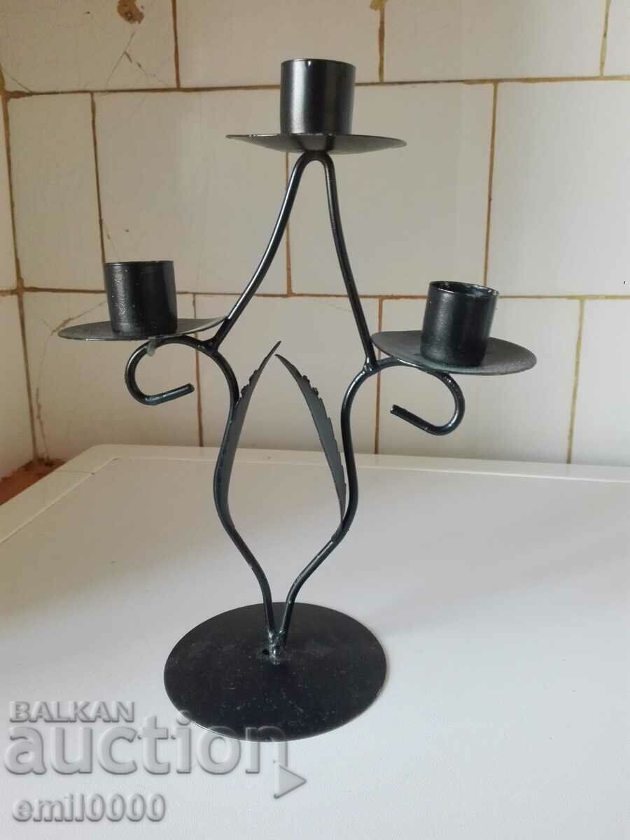Metal candlestick trio.