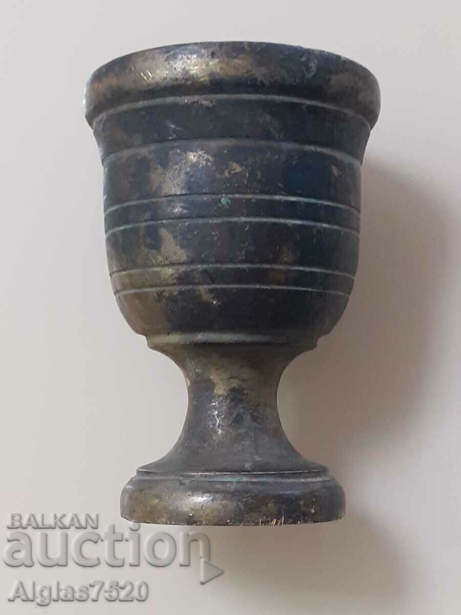 A very old bronze cup