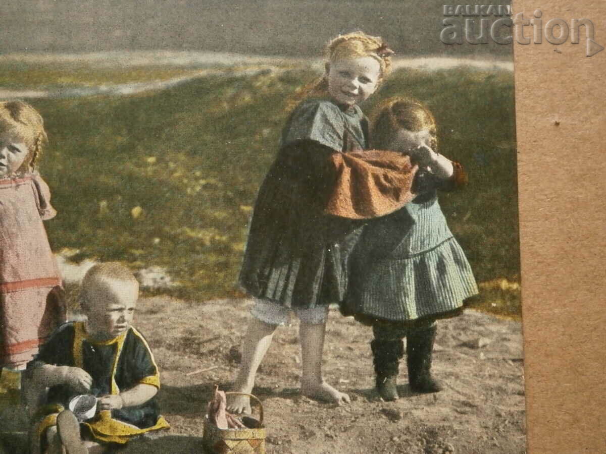 Delivery of vintage postcard of children on the beach in the 1930s Delivery of vintage postcard of children on the beach in the 1930s