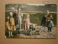 vintage postcard of children on the beach in the 1930s