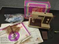 Old children's sewing machine with box and instructions
