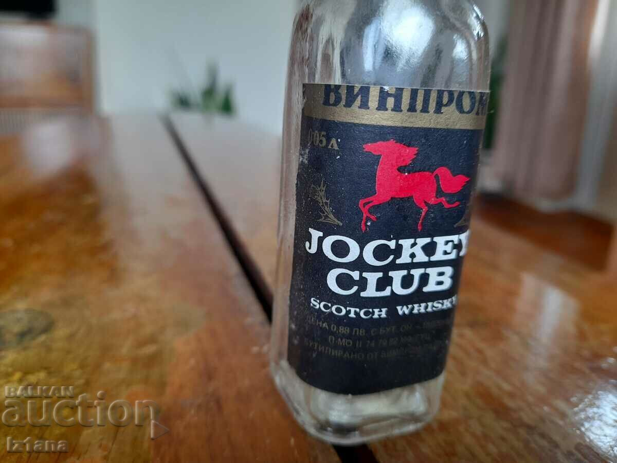 An old Jockey Club whiskey bottle with price 14.00 BGN | € 7.16 An old Jockey Club whiskey bottle with price 14.00 BGN | € 7.16