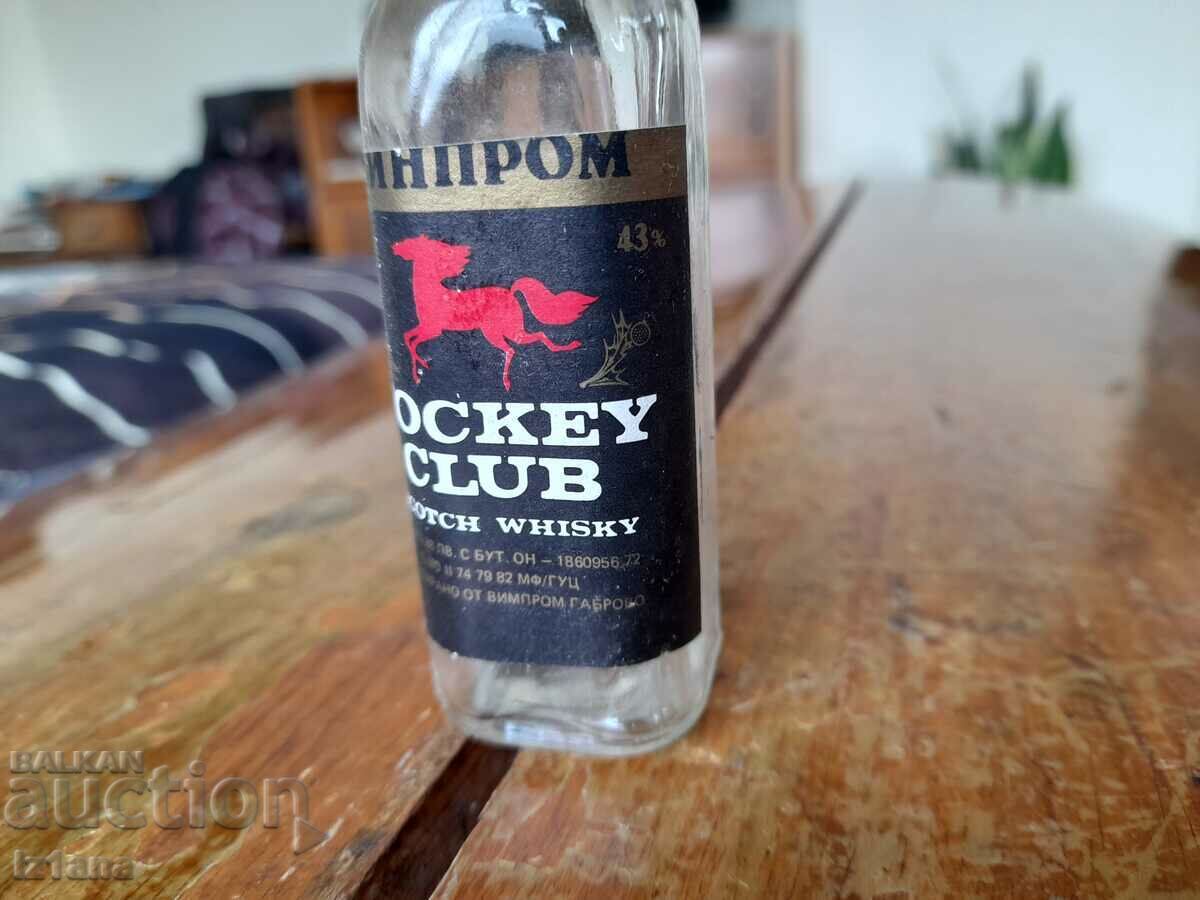 Auction An old Jockey Club whiskey bottle Auction An old Jockey Club whiskey bottle