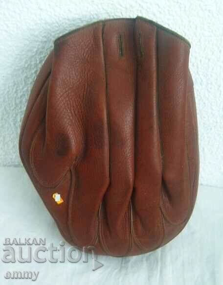 Old leather boxing glove for training, left hand