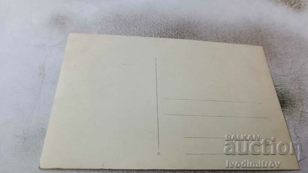 Photo Man and woman in front of a group of villas with price 3.65 BGN | € 1.87 Photo Man and woman in front of a group of villas with price 3.65 BGN | € 1.87