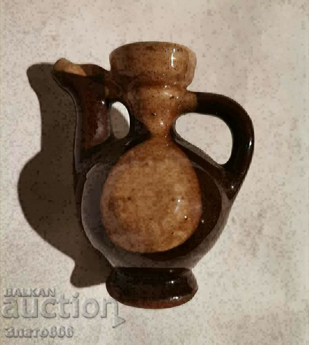 Old, small, decorative pitcher