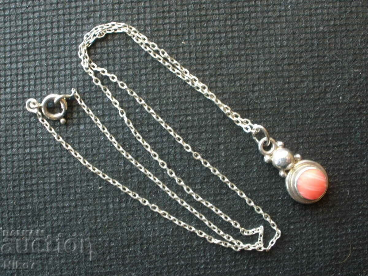 Silver, old pendant (necklace) with a pink stone.