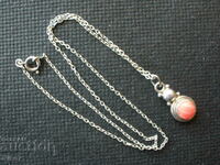 Silver, old pendant (necklace) with a pink stone.
