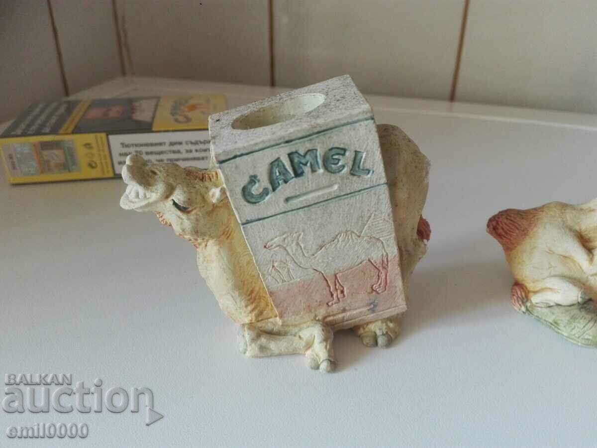 Auction Two plaster camel figurines. Auction Two plaster camel figurines.