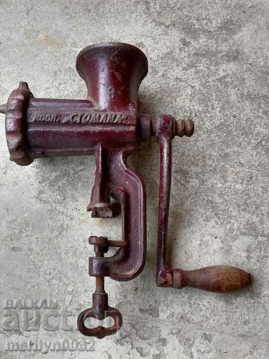 An old meat grinder, a milling machine