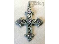 Openwork silver cross with amethysts.