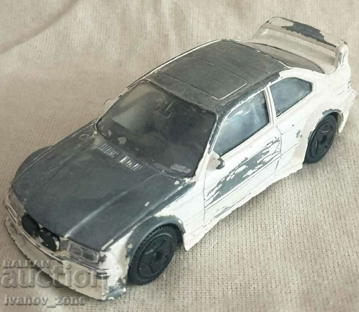 Mașină BMW M3 1/43 – Burago Italia.