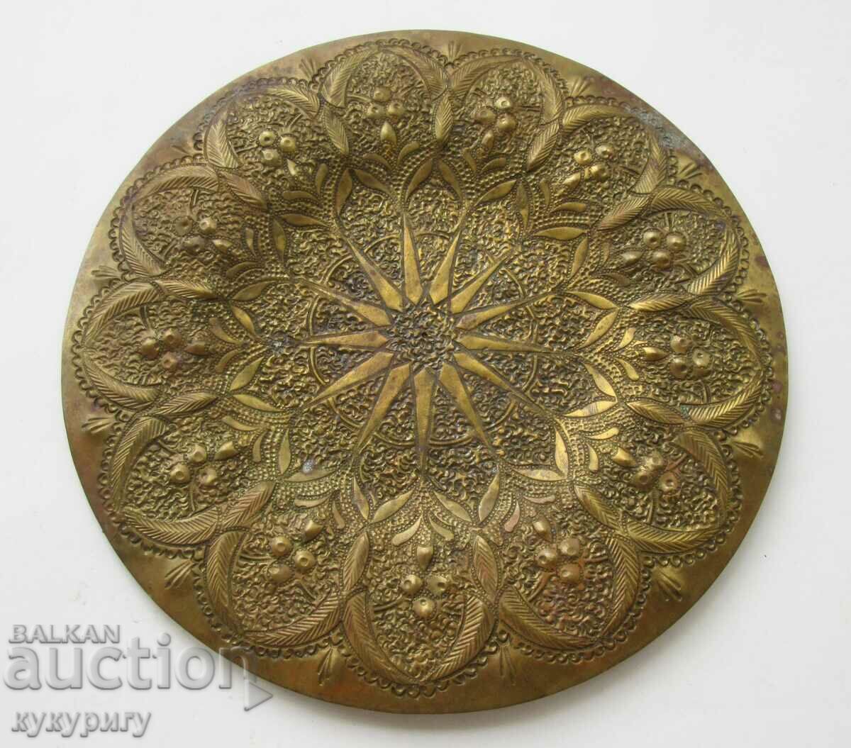 Old richly wrought bronze decoration plate wall panel