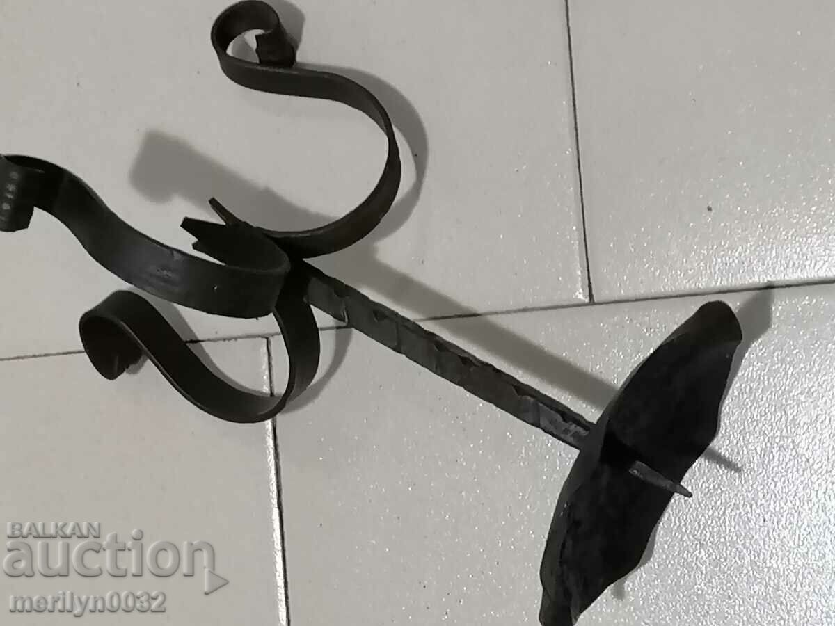 Auction  Old forged candlestick, candle