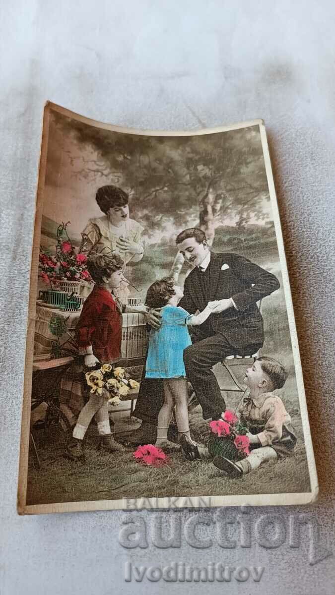 Postcard Man woman and three children