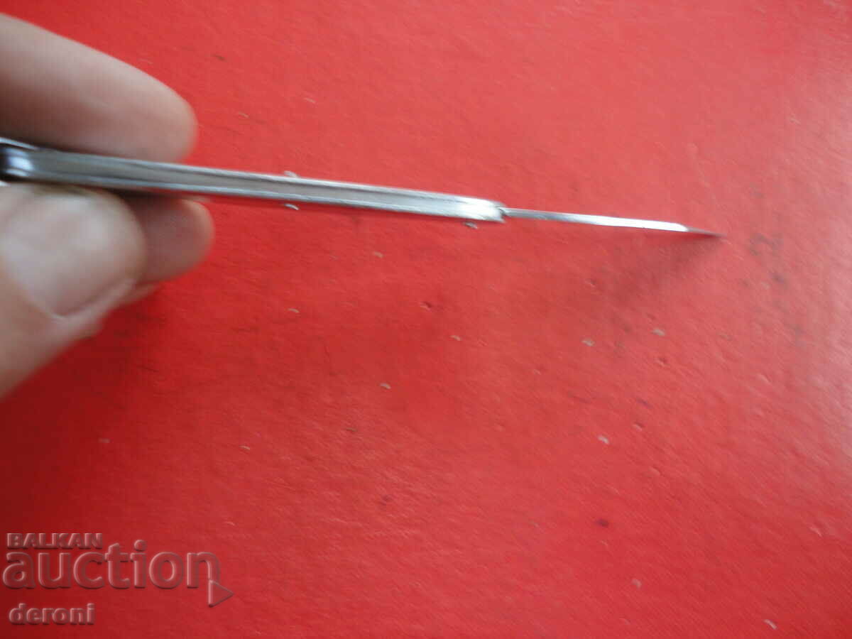 Auction German metal knife with opener Auction German metal knife with opener