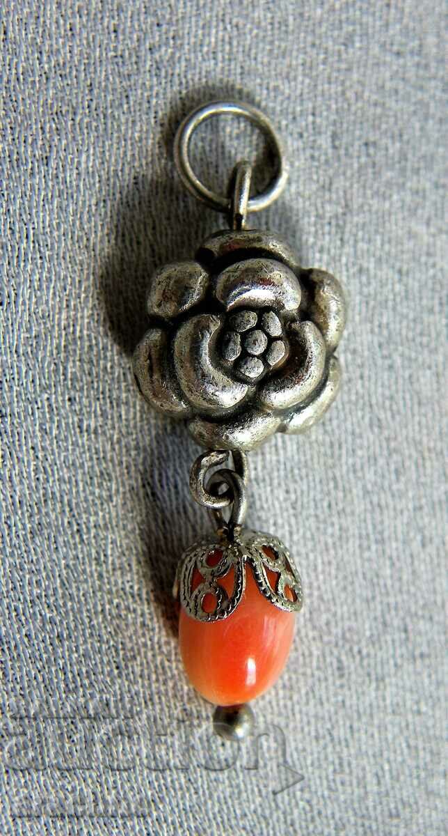 Central Asian silver medallion with coral, angel skin color