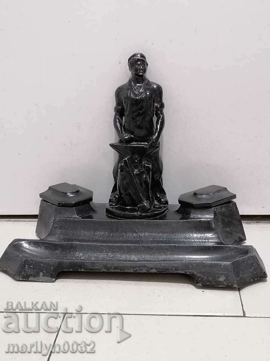 An inkwell with a figure of a blacksmith, a wounded social worker statuette of the NRB BKP