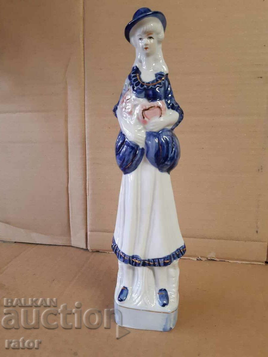 Old large porcelain figure, statuette. Porcelain